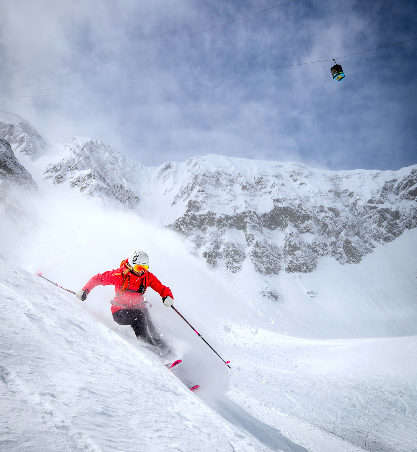 Person Skiing In Powder on Lone Peak Big Sky Montana