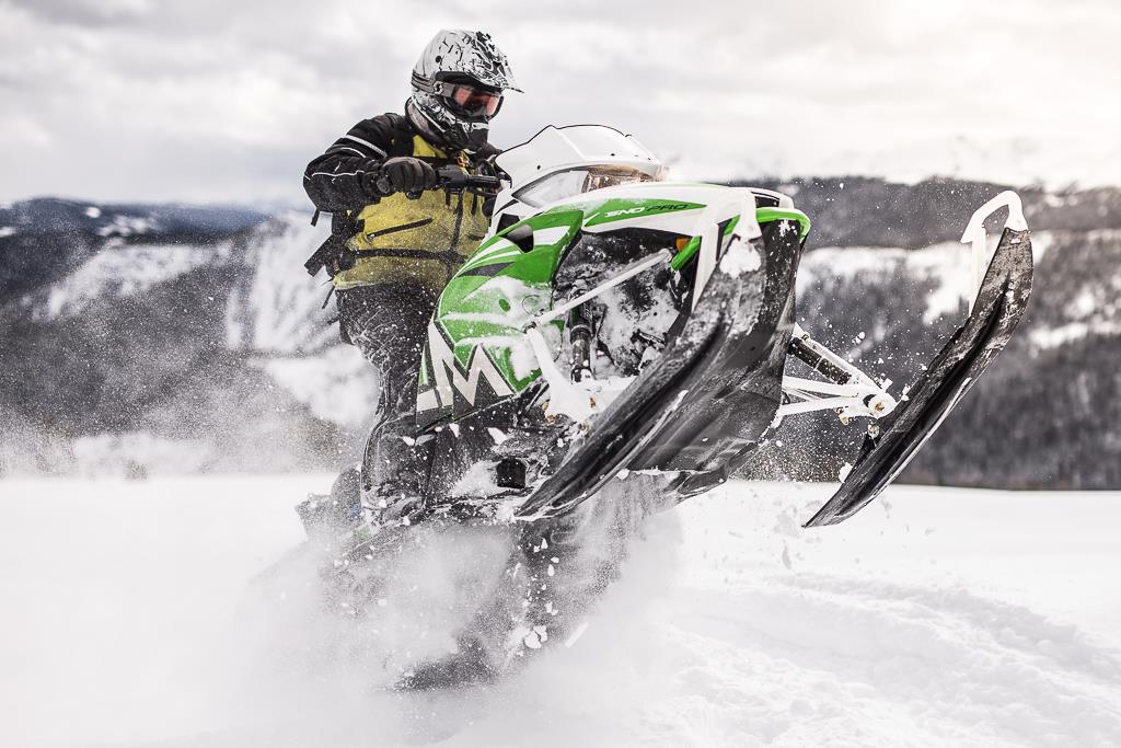 Person doing a trick on a Snowmobile