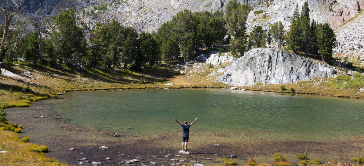 Big Sky pond and Mountains in background